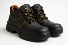 Professional product photography of Allen Cooper AC 1143 Safety Shoes. Black industrial work boots with steel toe caps and yellow/orange accents.